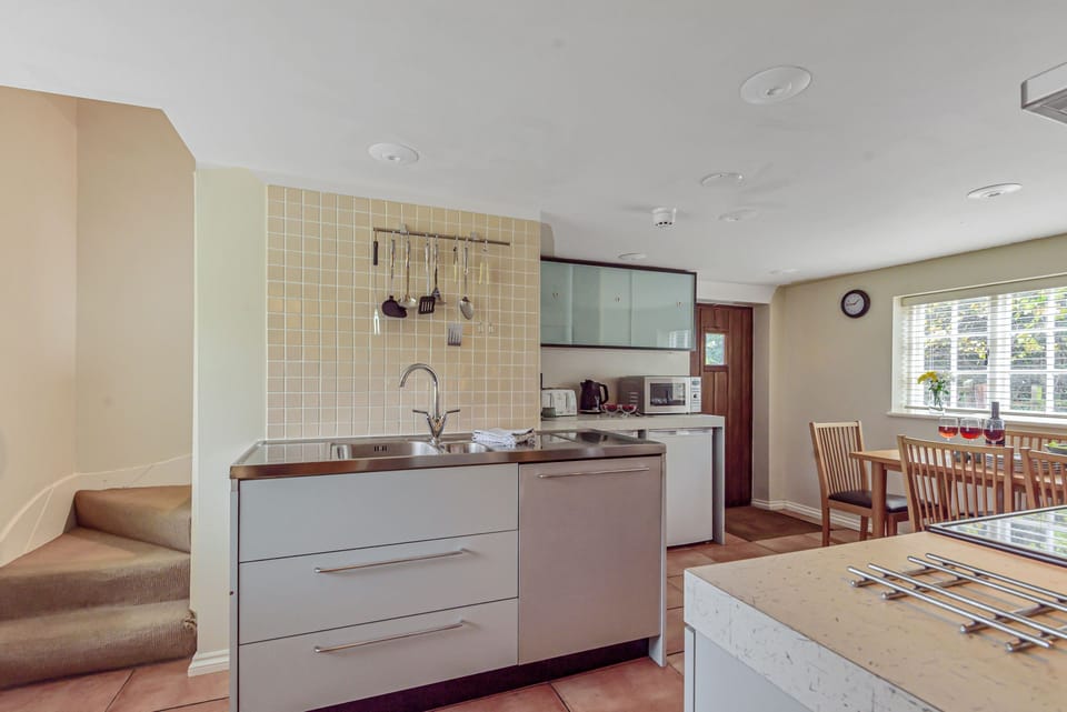 River Cottage, Athelhampton, Dorchester: Kitchen with stairs up to bedroom three