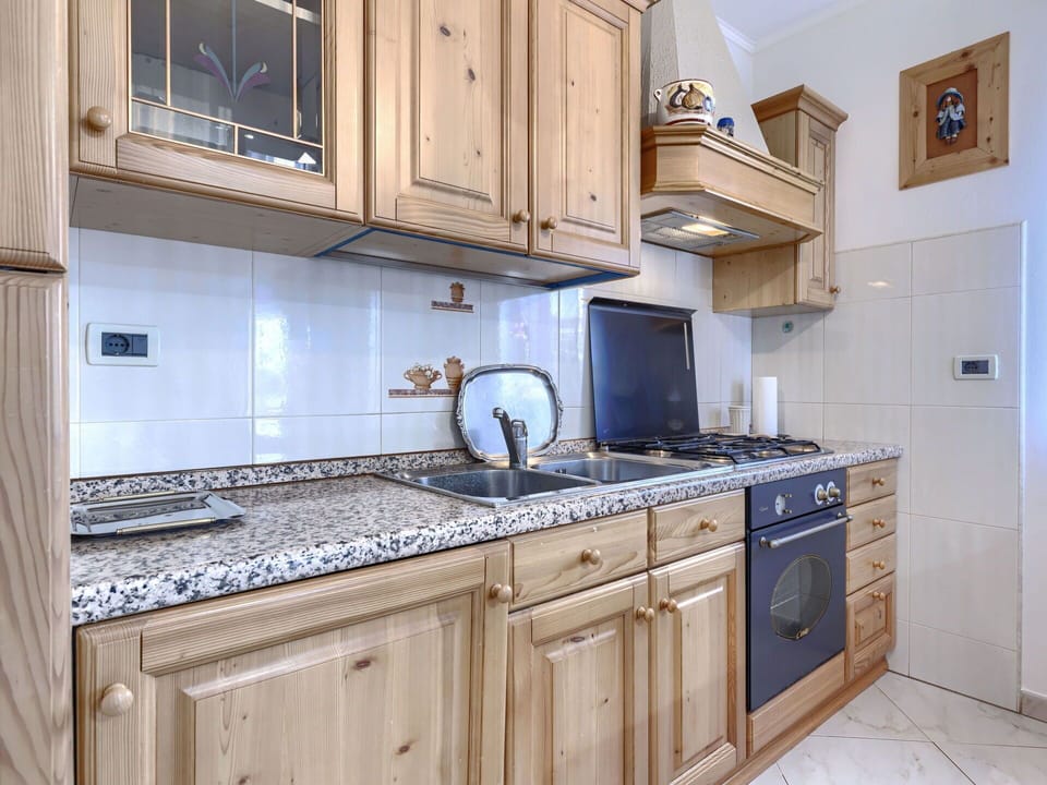Cabinetry, Kitchen, Wood, Interior Design, Countertop, Cupboard, Kitchen Appliance, Major Appliance, Drawer, Room