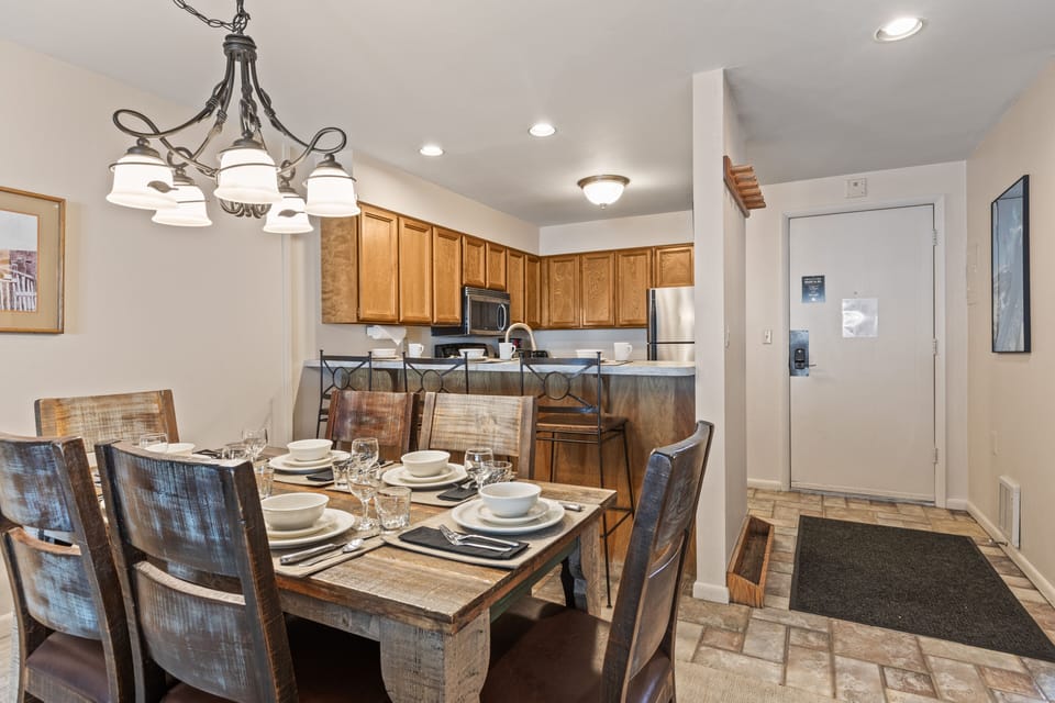 Snow Flower Condominium 147's dining room area next to open space kitchen concept.