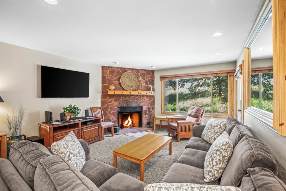 Snow Flower 007 offers a cozy living room with spacious seating and gas burning fireplace.