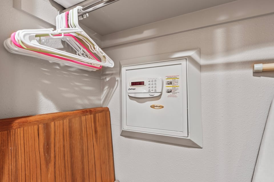 Snow Flower 72's built in wall safe in a closet with hangers.