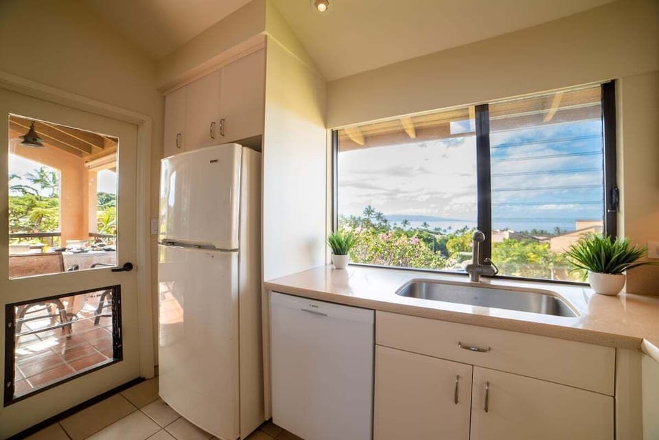 Cook in kitchens framed by greenery, cabinets, and ease.