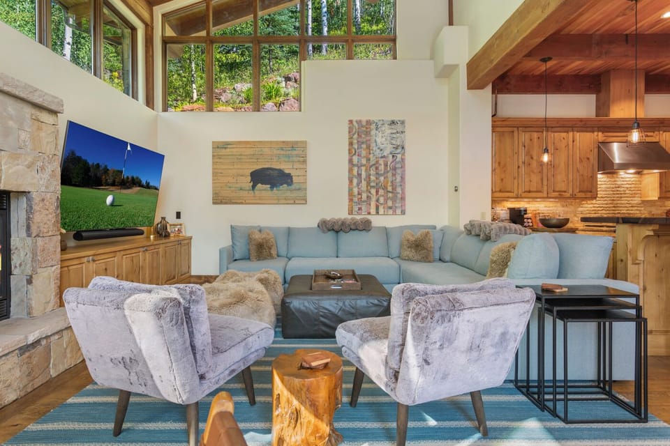 High vaulted ceilings and windows looking out to an aspen grove!
