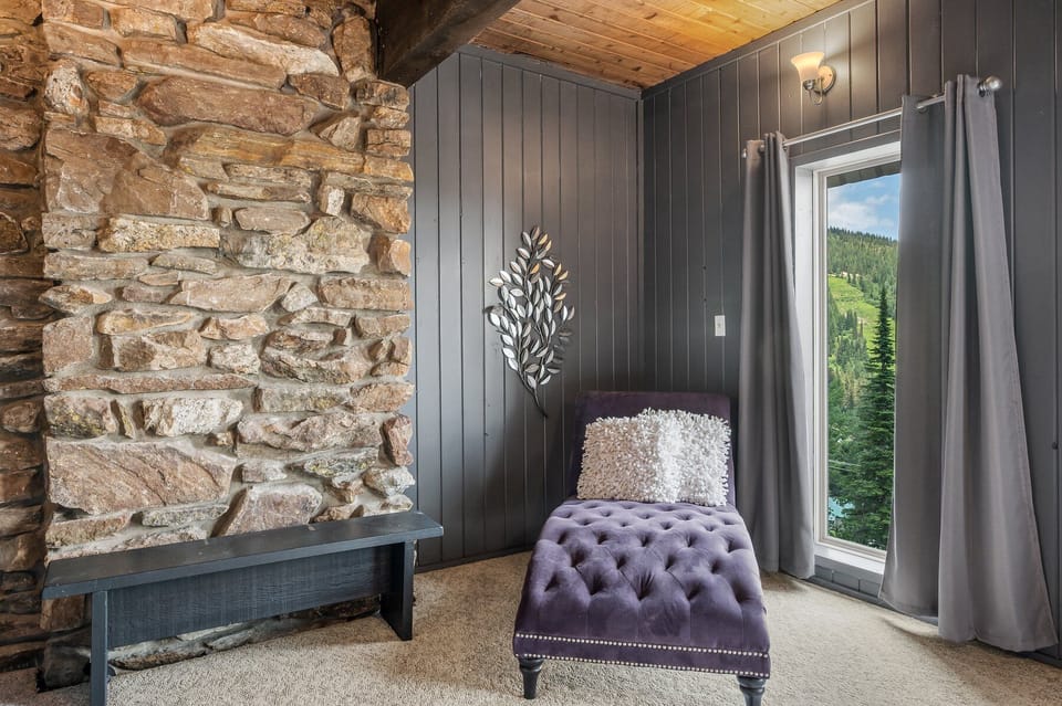 chaise in king master bedroom