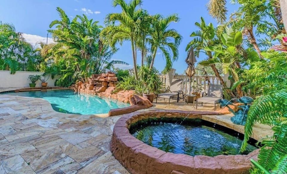 Private resort style pool with waterfall & koi pond