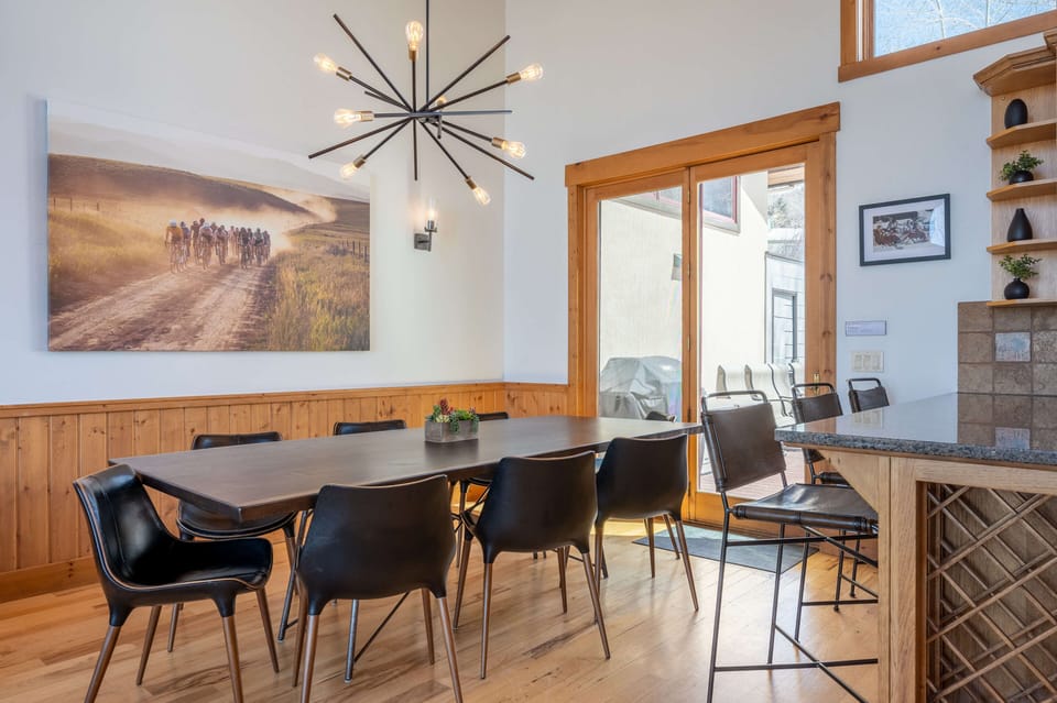The dining room table has room for eight along with three bar seats (patio access)