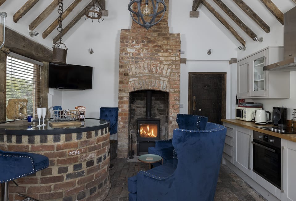 Ground floor: Open-plan living space with a unique focal point, a 40-foot well with a glass top features as the dining table