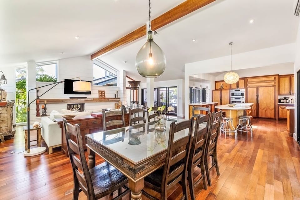 The dining area openly flows to the main living area and kitchen.
