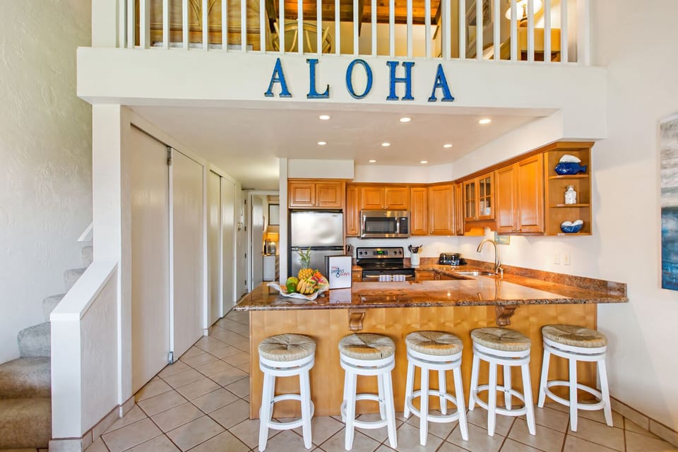 Spacious kitchen area with counter top seating