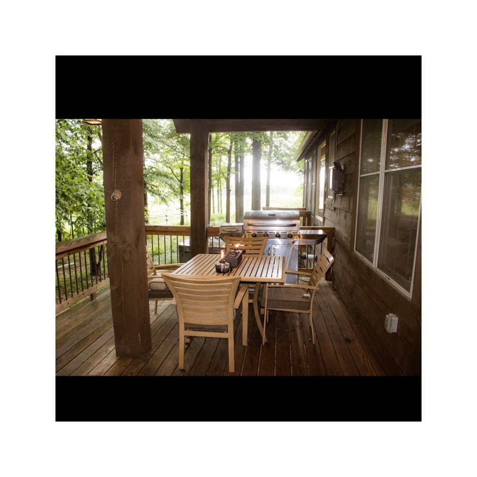 Dinner table and grill under
Cover porch