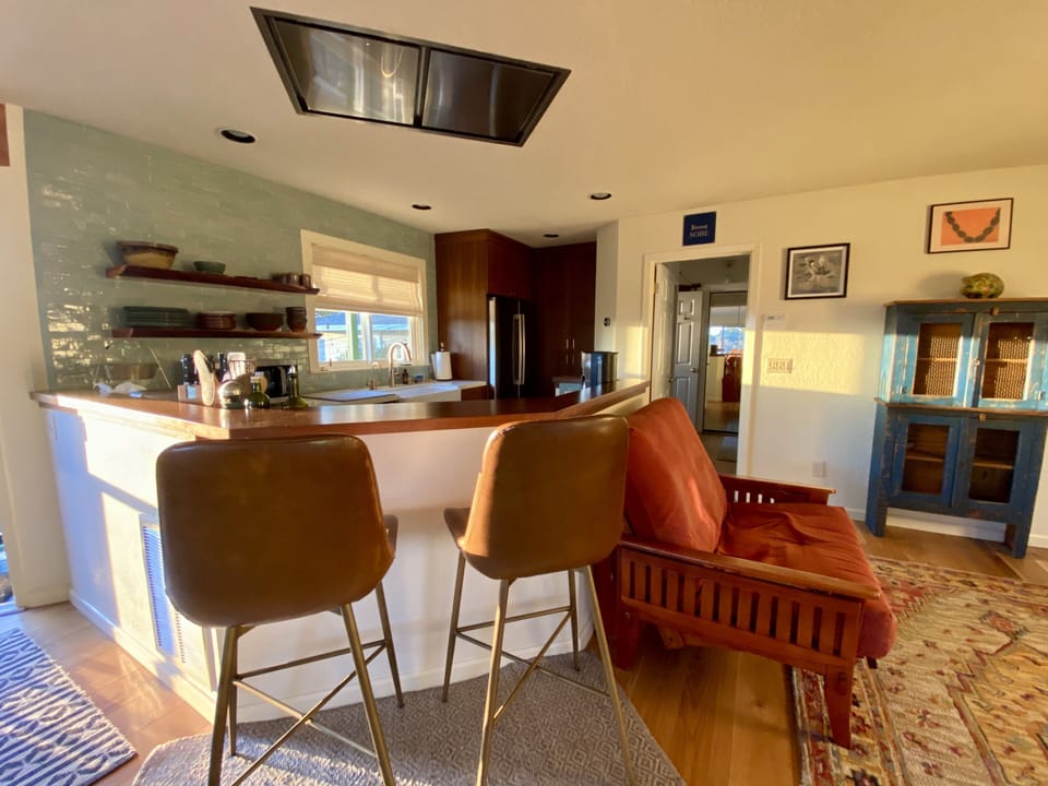 Modern open kitchen with updated appliances for luxury living
