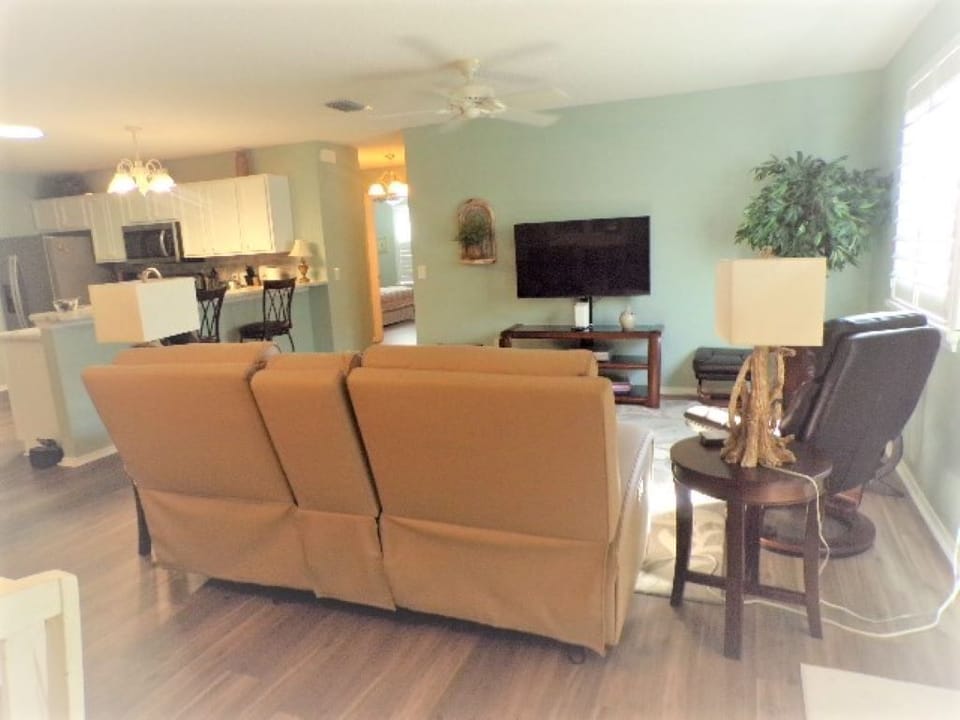 Dual recliners has adjustable head rest feature for added comfort.