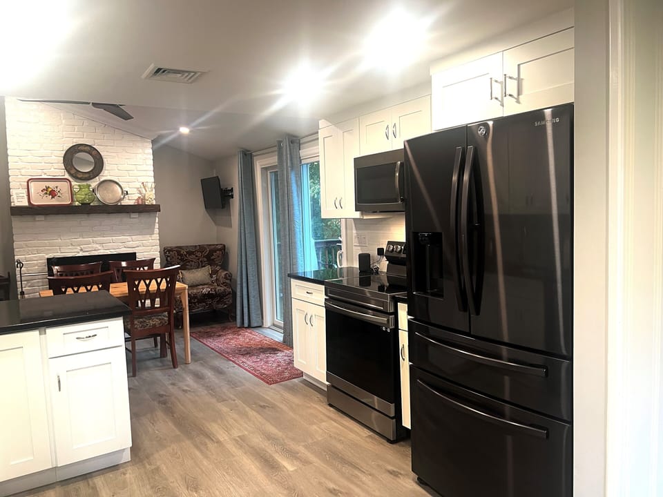 Refrigerator new stove  micro wave  and sliding doors to the deck  
