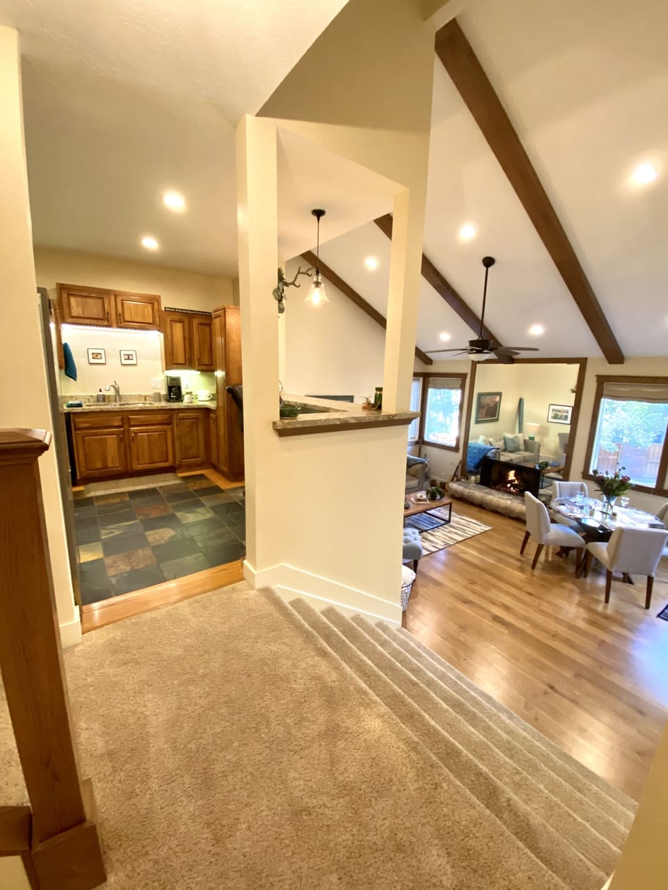 View from Den to same level Chef's kitchen. 1/2 flight down to living room. 