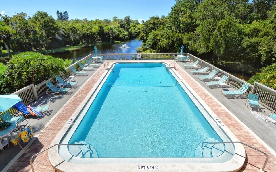 1 of 2 community pools overlooking lake