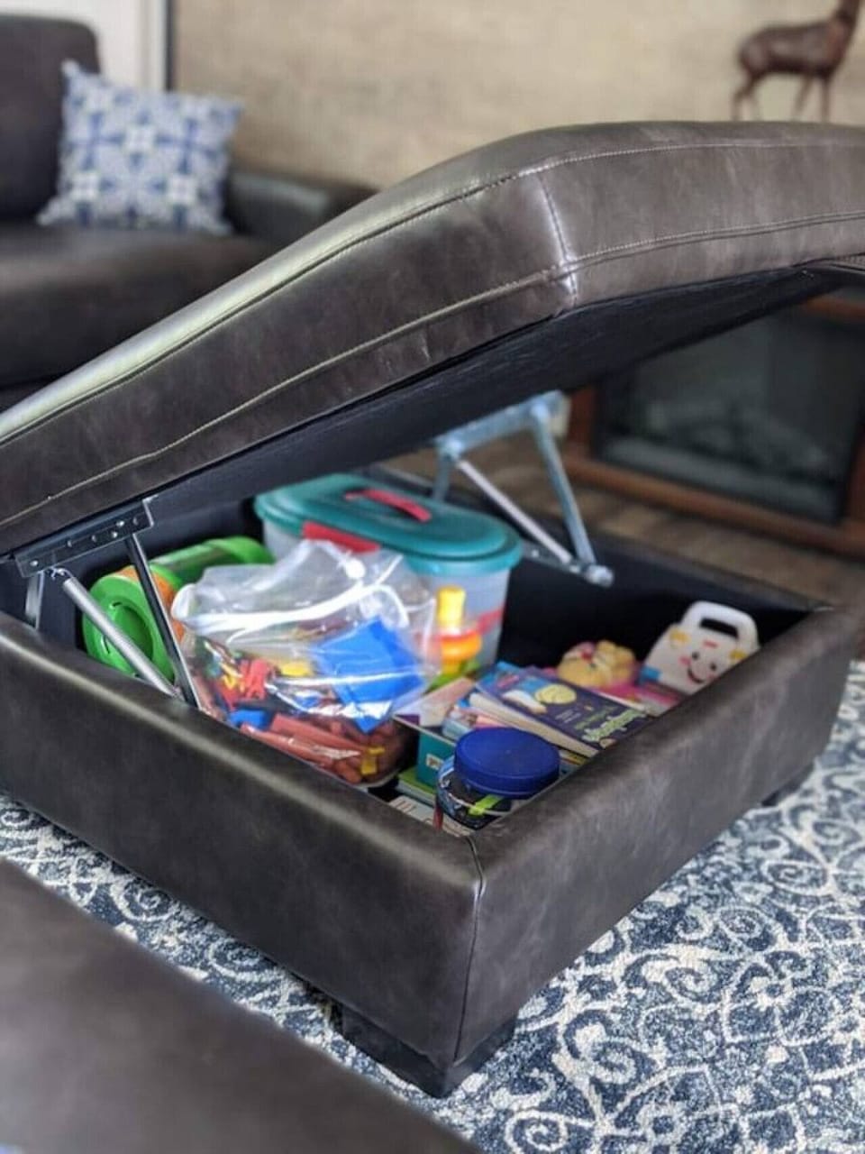 Toys and books are located inside the ottoman for kids