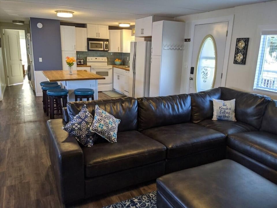 A view of the hallway leading to the main bedroom and washer and dryer