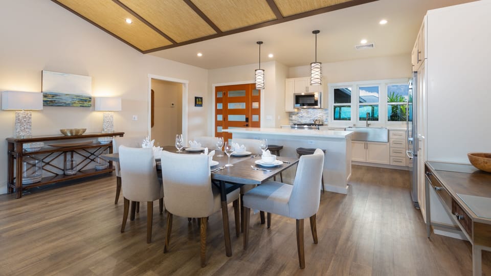 Dining table for six with additional seating for three at the bar