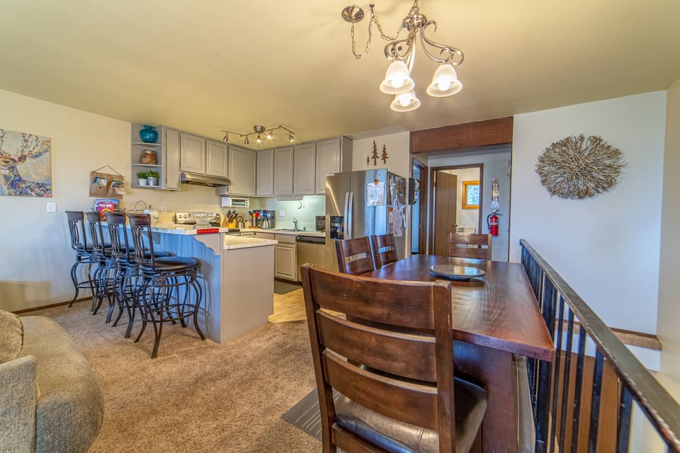 Dining Area and Kitchen with door to bath & bedroom.