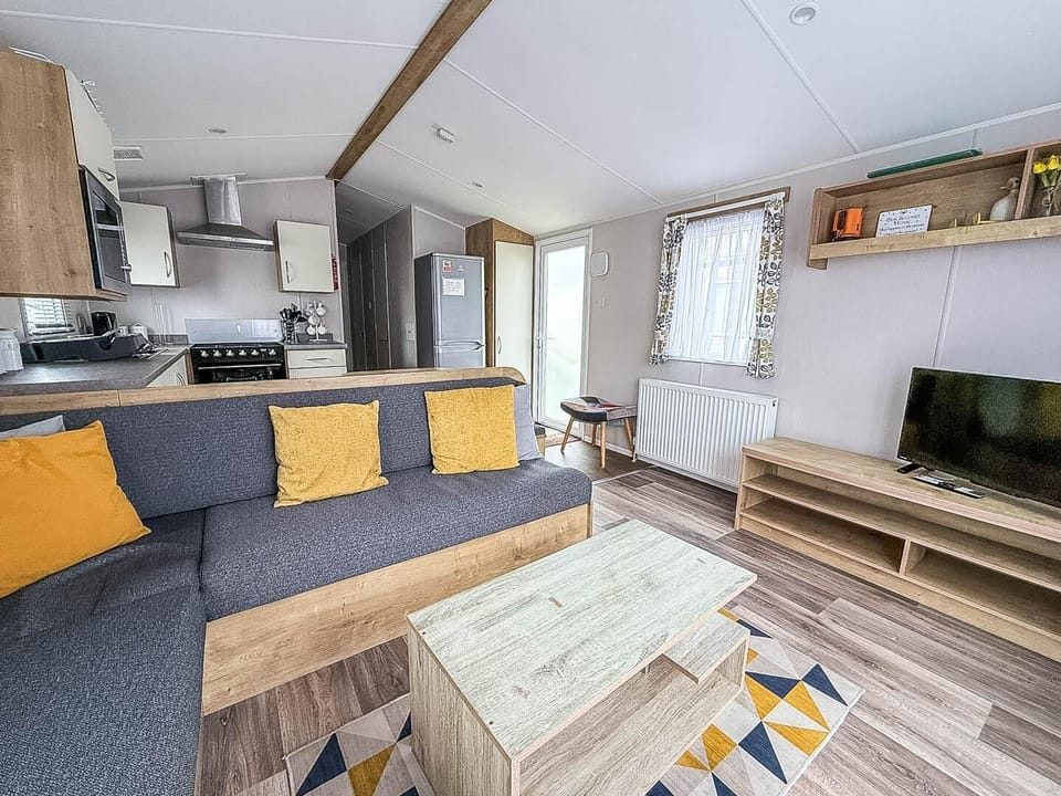 The caravan living area is perfect for quality time, board games, or simply putting your feet up with a cup of tea while recounting the day's adventures.