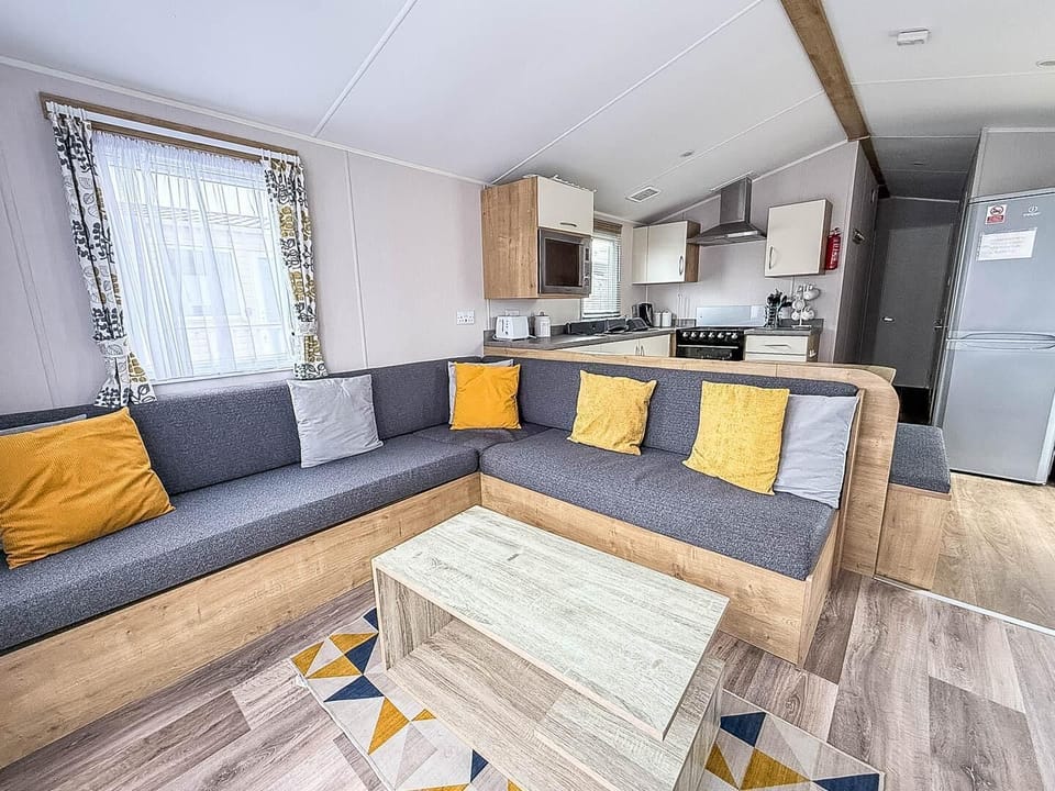 Situated conveniently opposite the kitchen, this dining table is the ideal spot for sharing meals, playing board games, or simply planning your next day's adventure on the Norfolk coast.