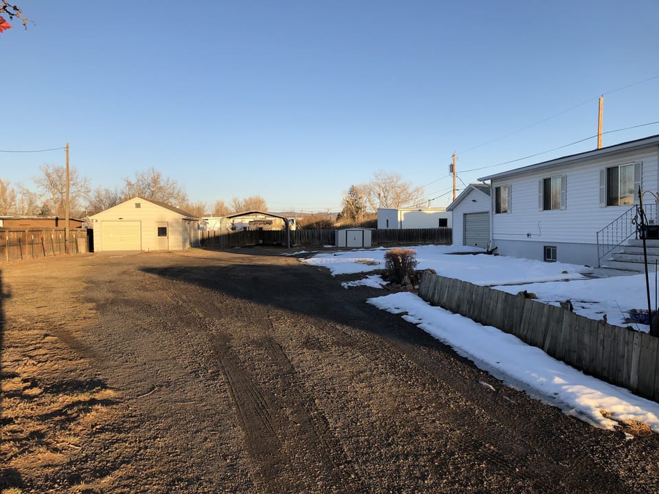 View of off-street parking and front of house.