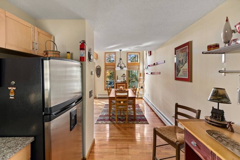 Updated kitchen with stainless steel appliances and granite countertops.