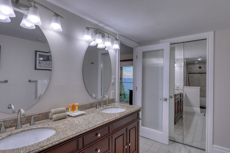 Dual sinks in master bathrooms, granite countertops