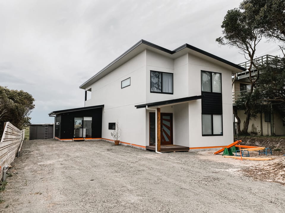 Jandi House. View from Grevillia Street, room for cars and boats