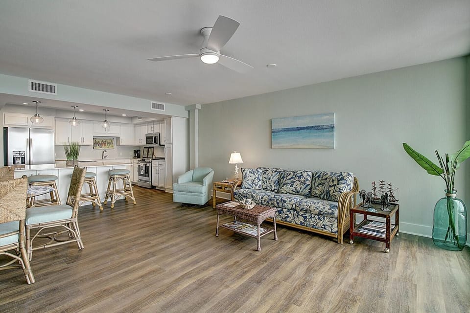 Relax in your airy open-concept space with coastal touches, where sea-inspired decor meets modern comfort in every corner.