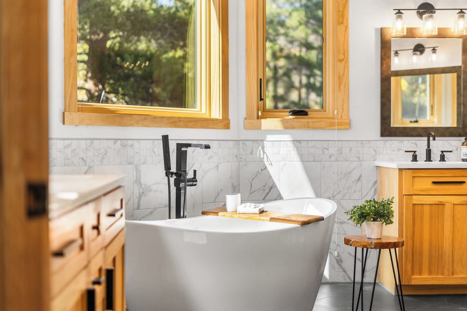 Soaking tub with double vanities in primary bathroom
