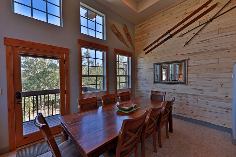 Large table with seating for 8 and local "blue stain" beetle kill wood wall.