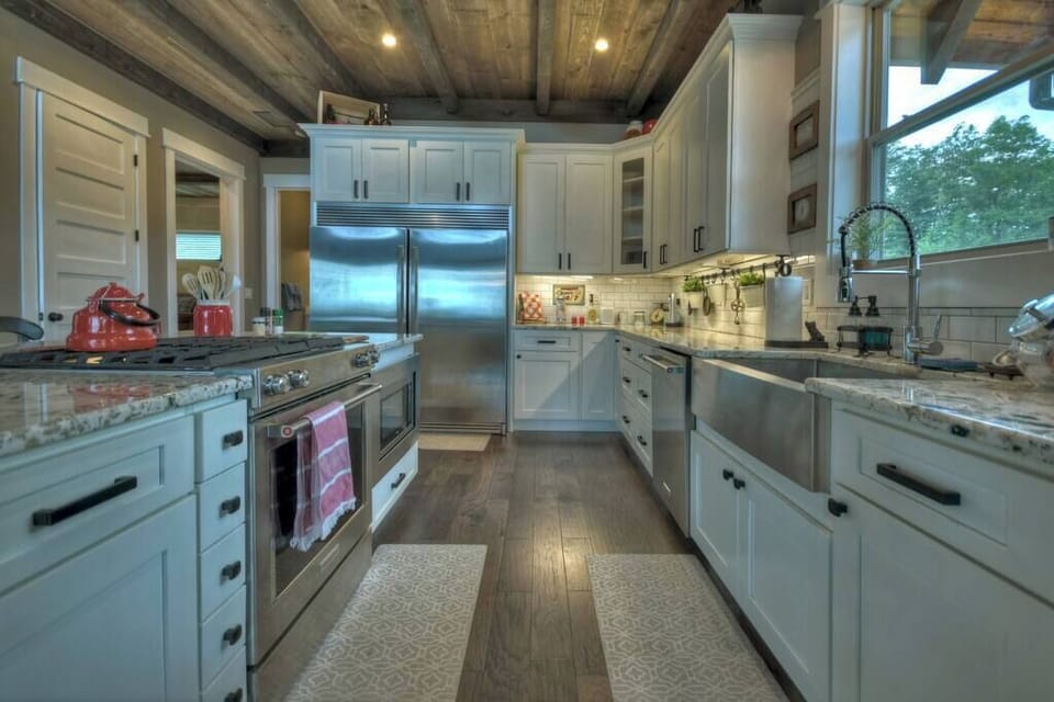 Fully equipped kitchen with stainless steel appliances and granite countertops 