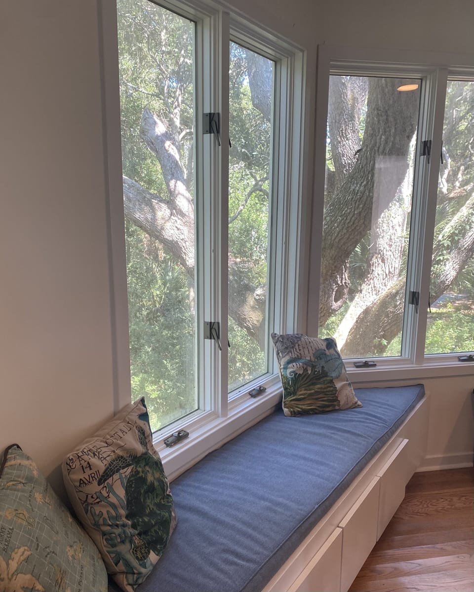 Dining window bench for bird watching with coffee. 