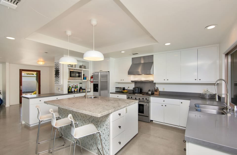 Kitchen includes diswasher, microwave, espresso machine, blender, food processor
