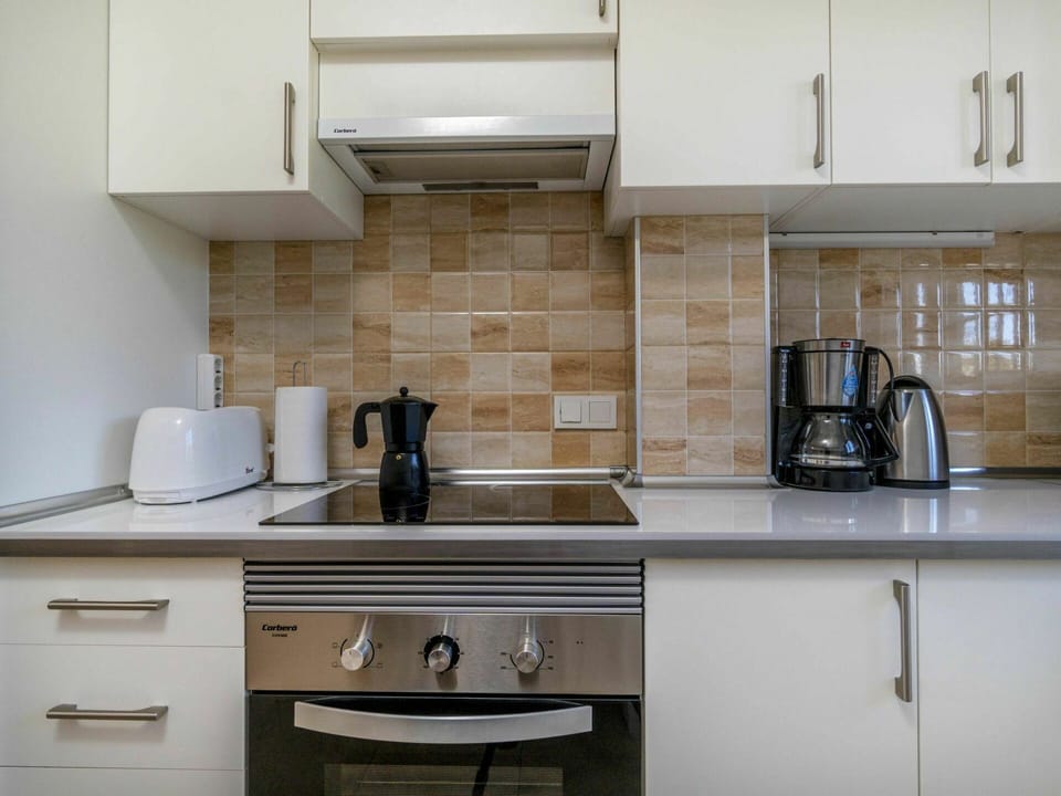 Countertop, Room, Cabinetry, Kitchen, Property, Furniture, Tile, Kitchen Stove, Interior Design, House
