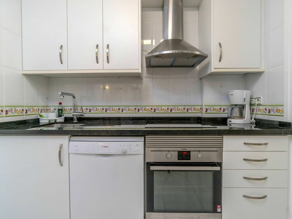Kitchen, Room, Cabinetry, Property, Countertop, Furniture, Material Property, Kitchen Appliance, Kitchen Stove, Interior Design