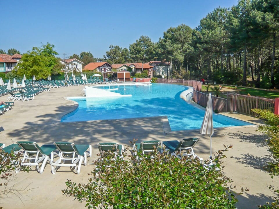 Water, Plant, Sky, Property, Swimming Pool, Azure, Shade, Tree, Outdoor Furniture, Building