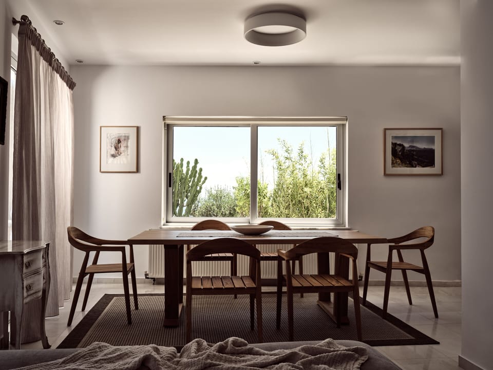 The living-cum-dining area features mesmerising sea views & retro design.
