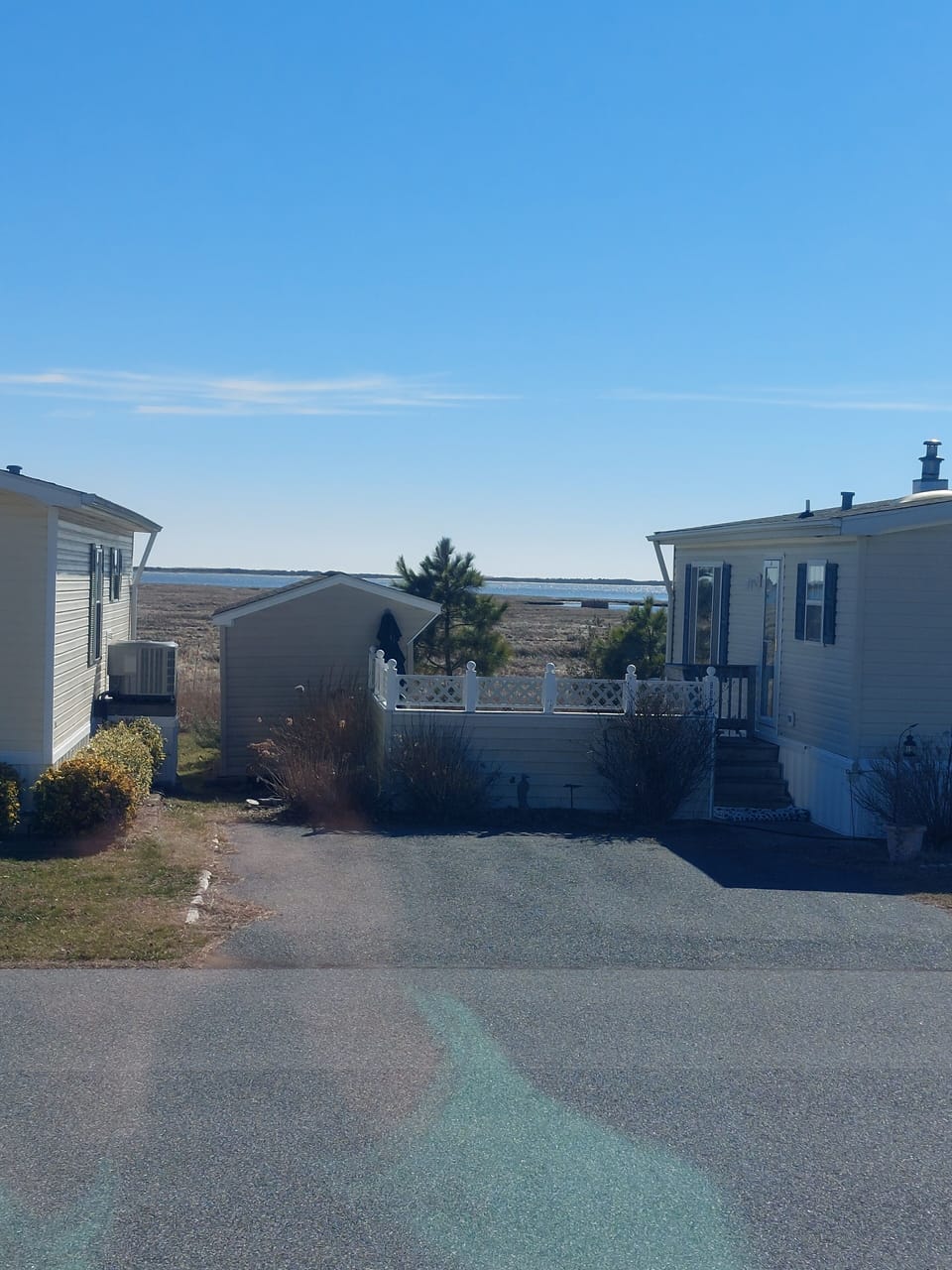 Bay views from front steps, patio and living room area.