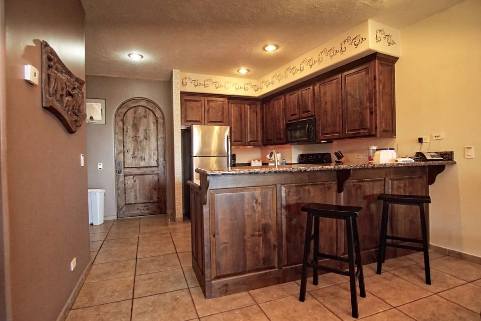 Kitchen with custom stencils on the walls.