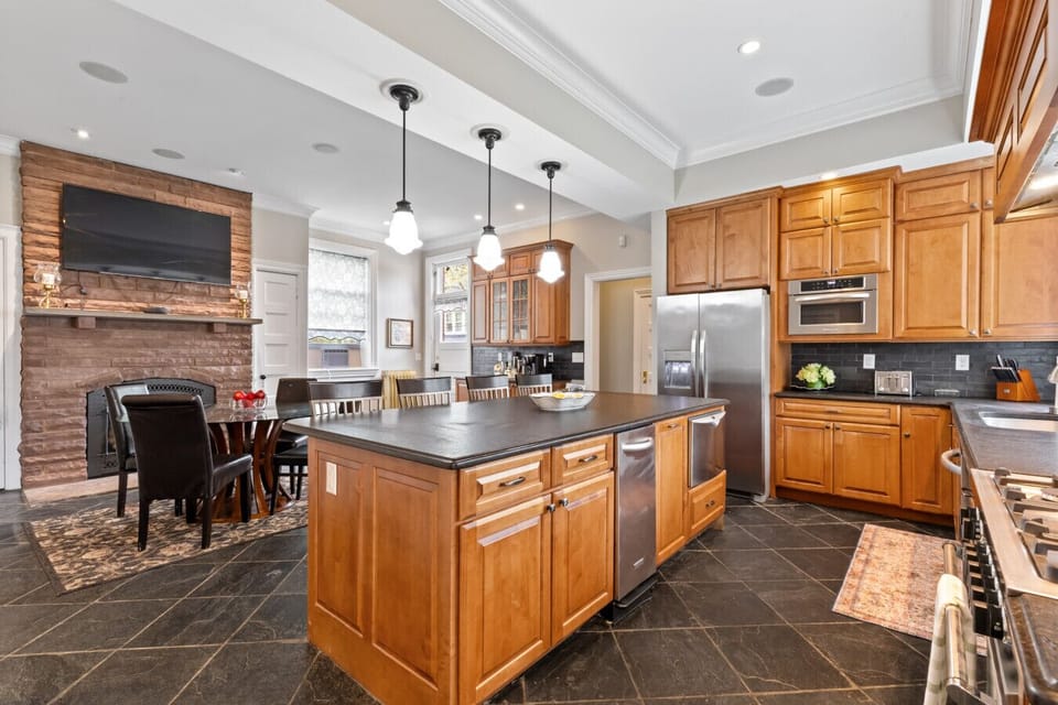 Large airy kitchen with TV and gas fireplace