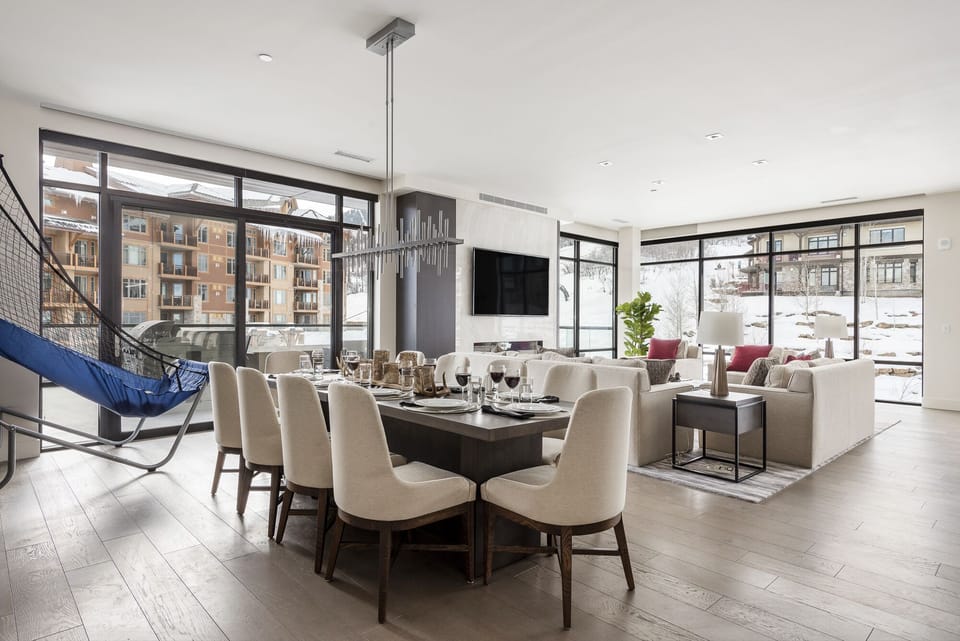 Elegant dining room with living room in the background