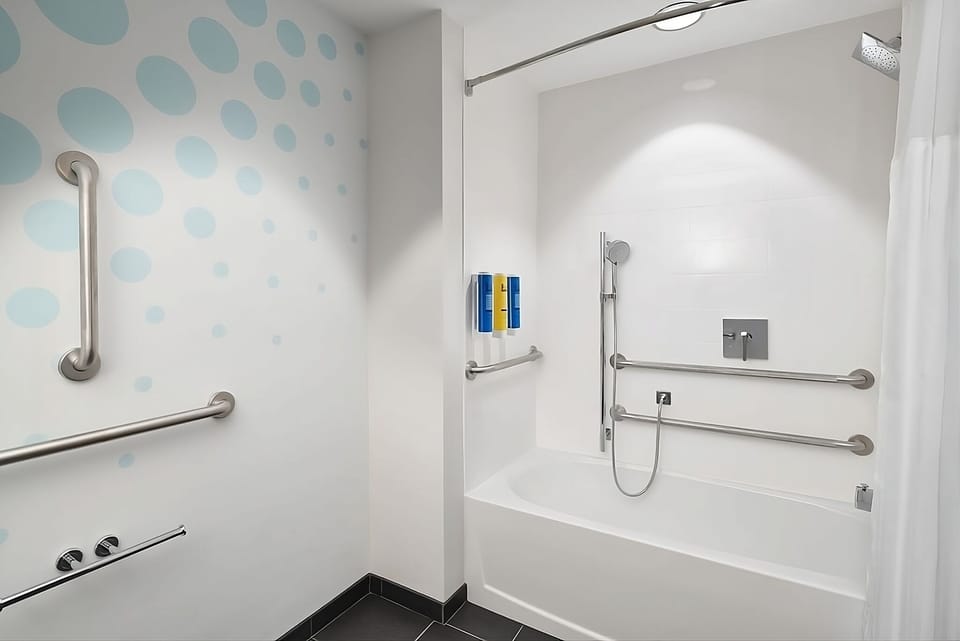 Bathe comfortably with an accessible tub, grab bars, and handheld shower.