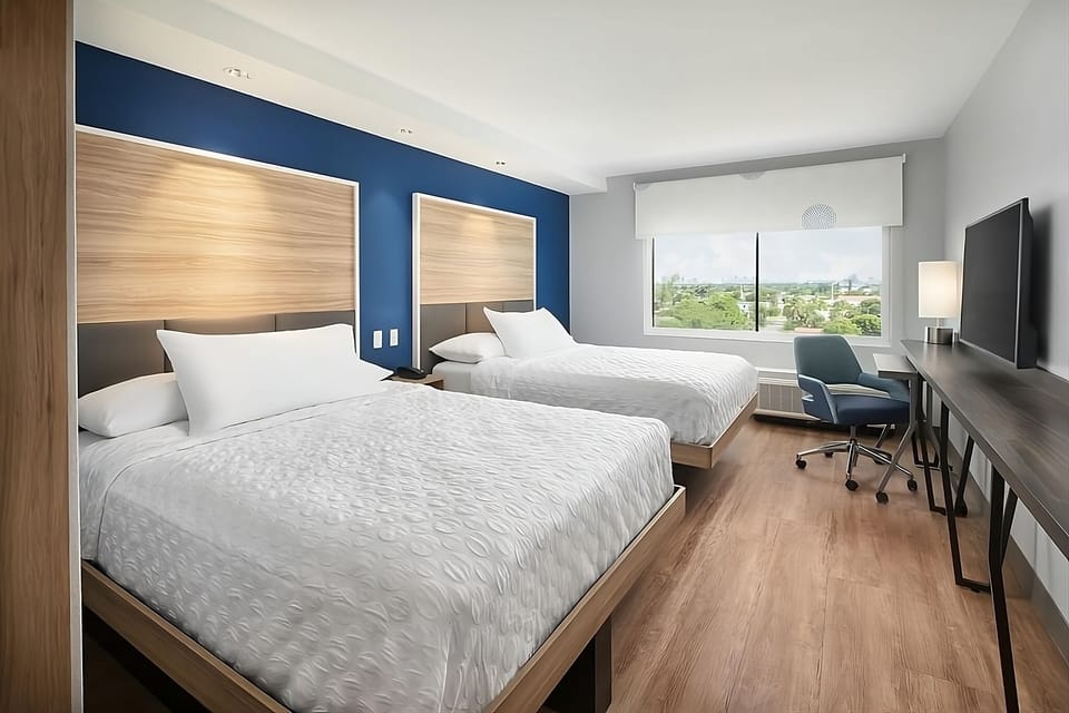 Unwind in a bright double-queen room with calming views.