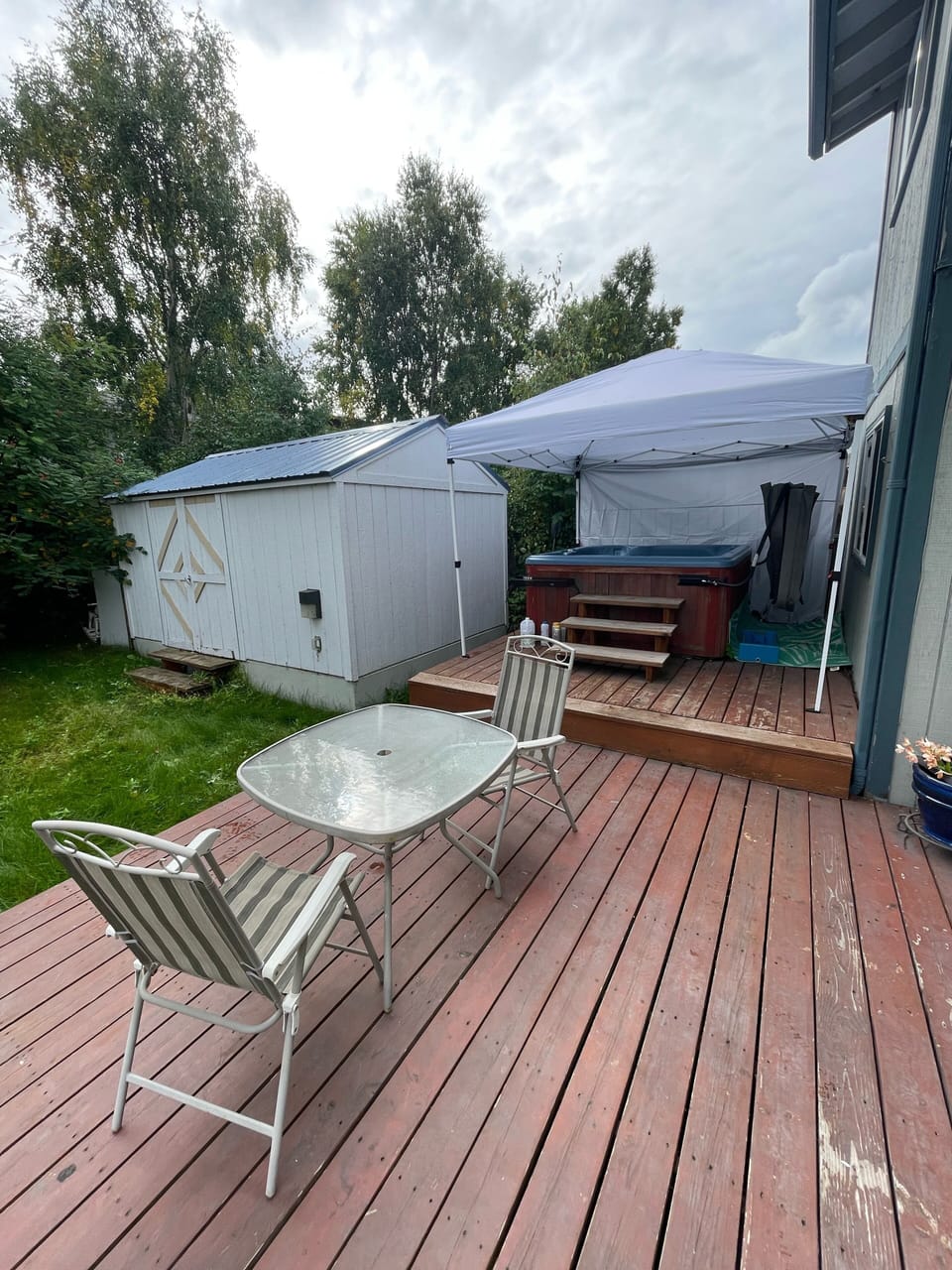 Back deck with hot tub that’s ready for use. 