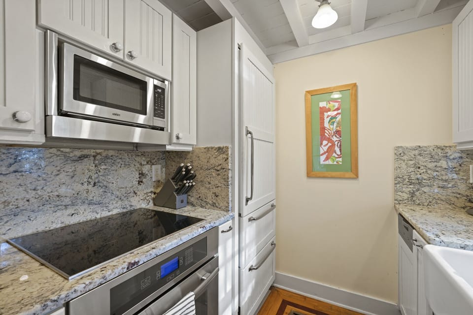 KITCHEN WITH NATURAL LIGHT SHINING THROUGH WINDOW