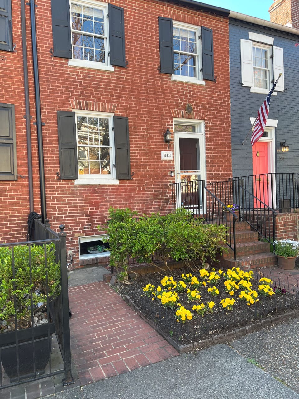 Path to steps down to a fully renovated English Basement in historic Old Town.