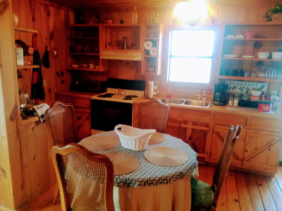 Dining table and kitchen. Perfect place to dine or games and conversation.