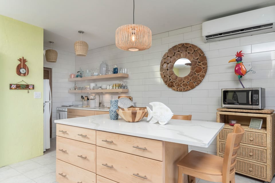 Dining area opens to the renovated kitchen.